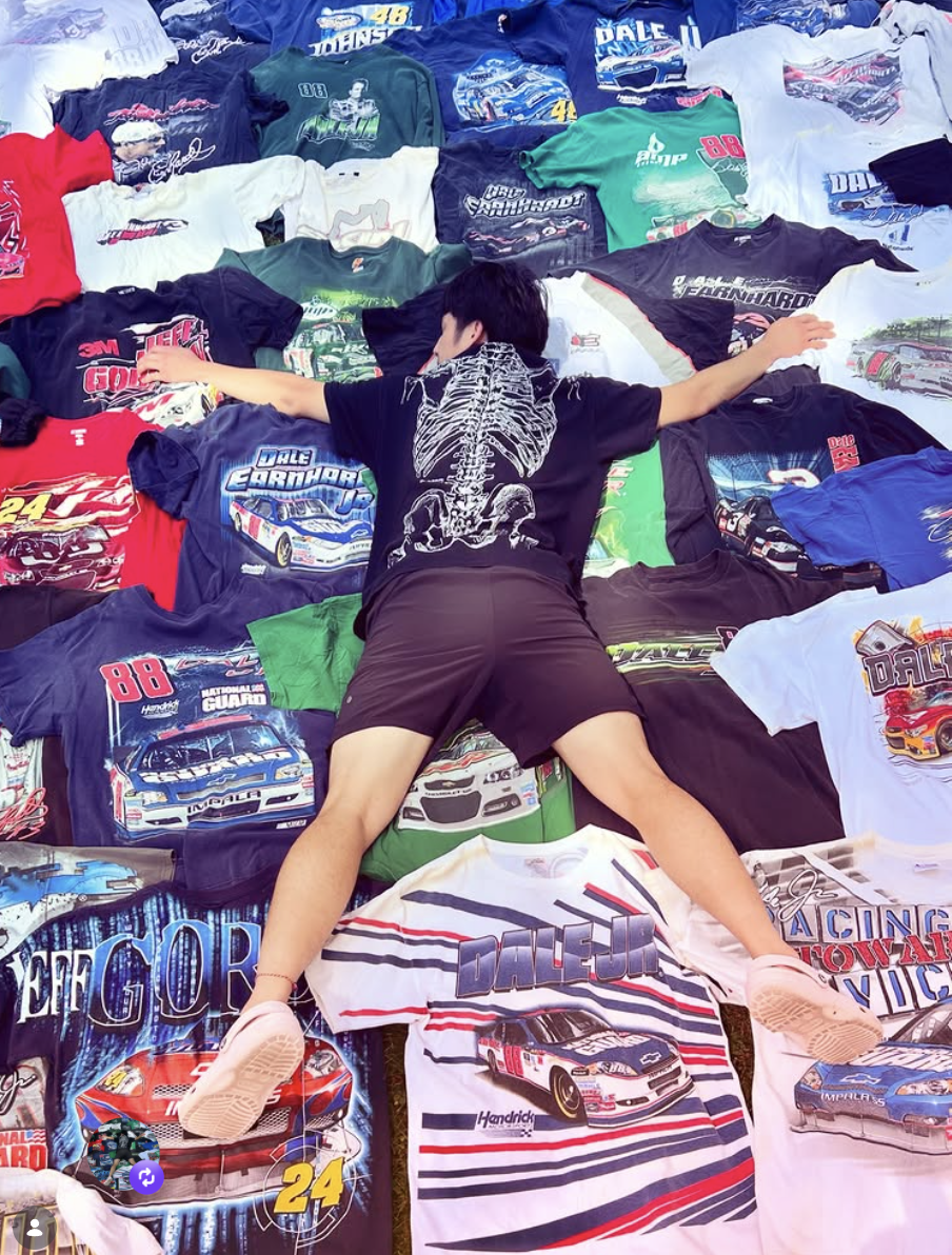 Two Cool Vintage founder laid out across a full floor of vintage NASCAR racing tees