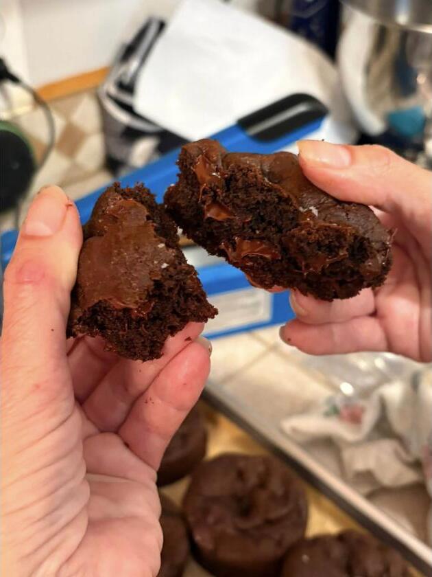 A frosted brownie broken in half