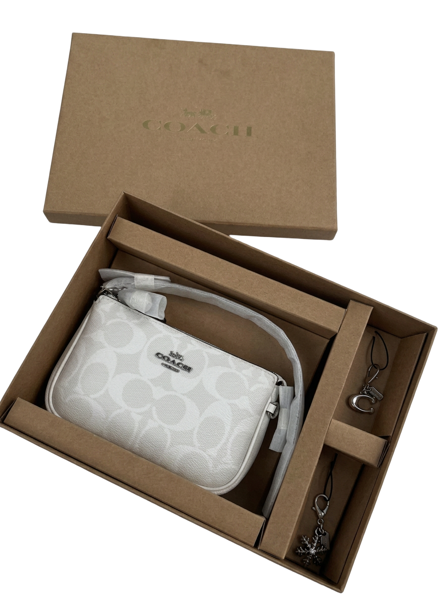 White signature Coach wristlet gift set in its box