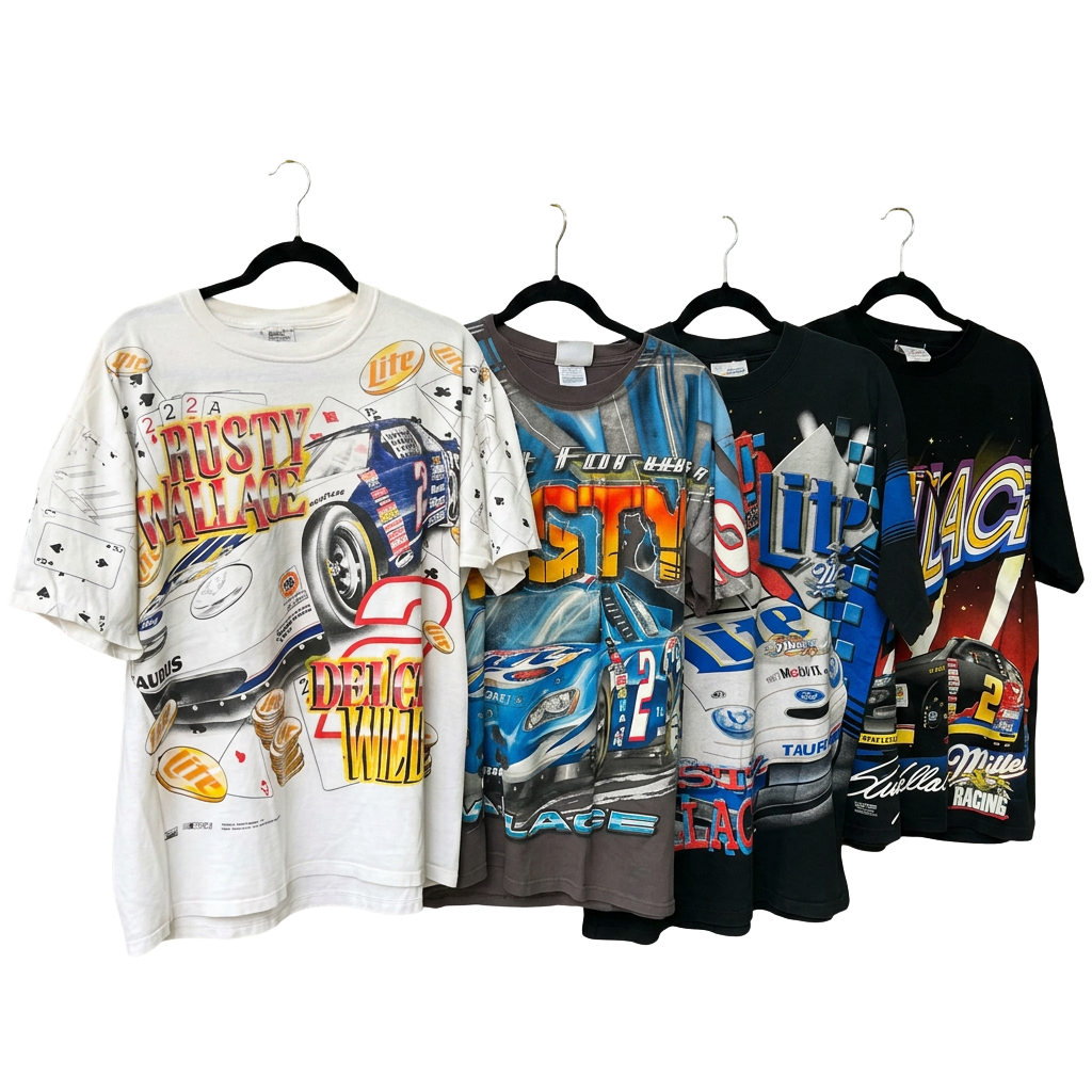 Four vintage NASCAR racing tees hanging side by side on hangers